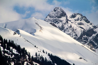 Scenic view of mountains against sky during winter