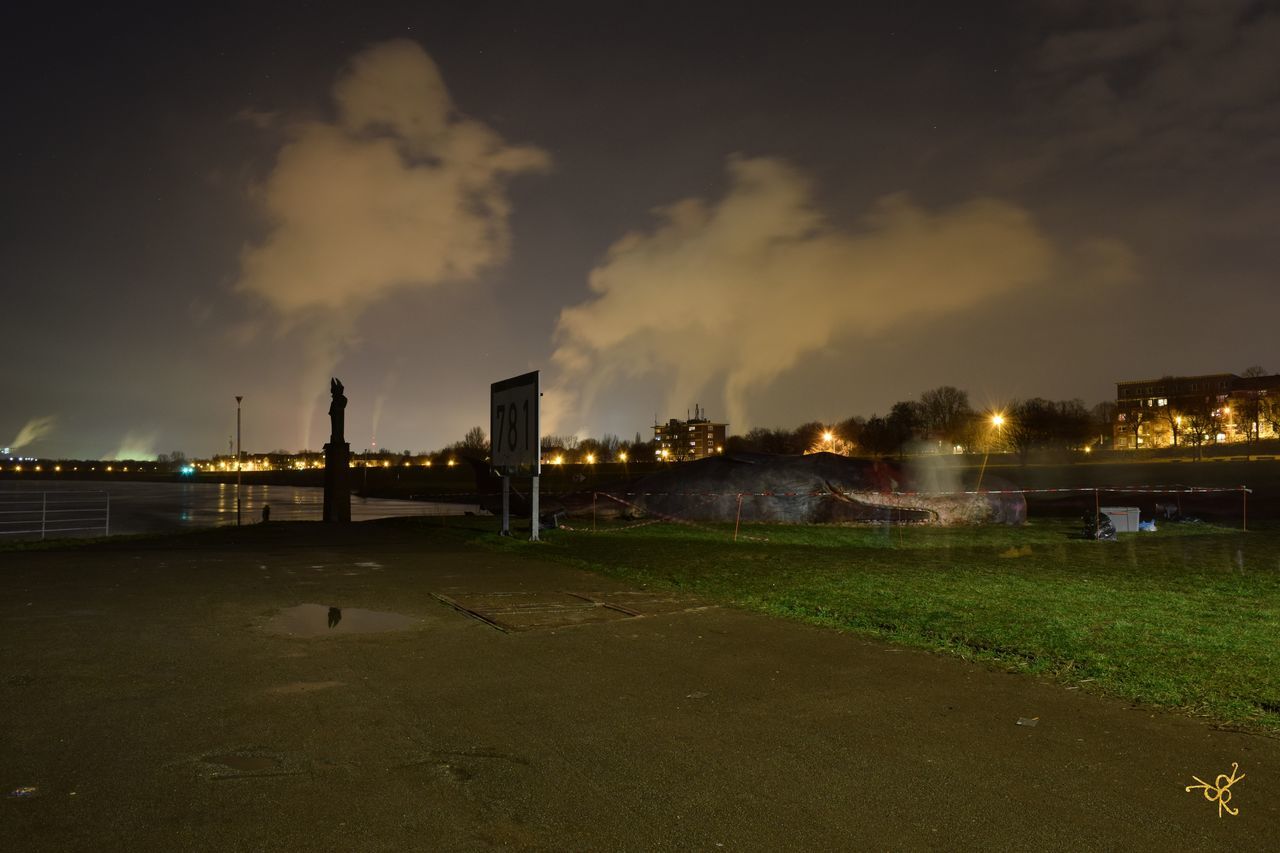 VIEW OF ILLUMINATED BUILDING AGAINST SKY