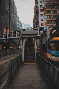 Train on bridge in city