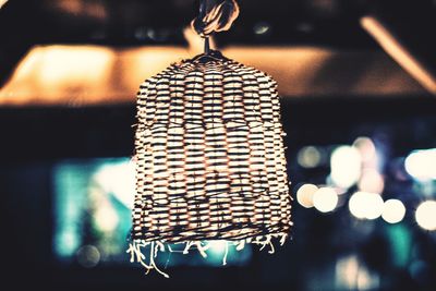 Close-up of illuminated lamp hanging at night