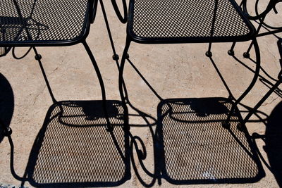 High angle view of chairs on table