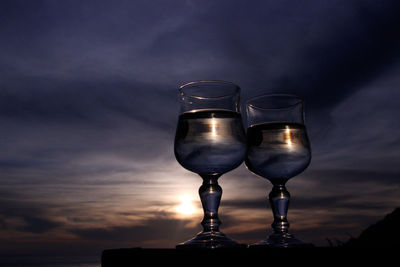 Reflection of dusk on water in drinking glasses