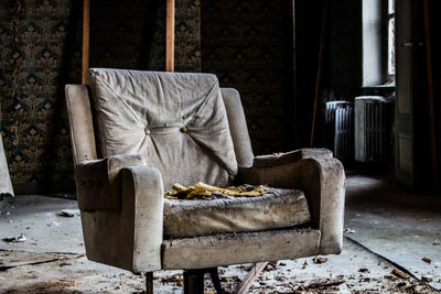 Damaged chair in abandoned room