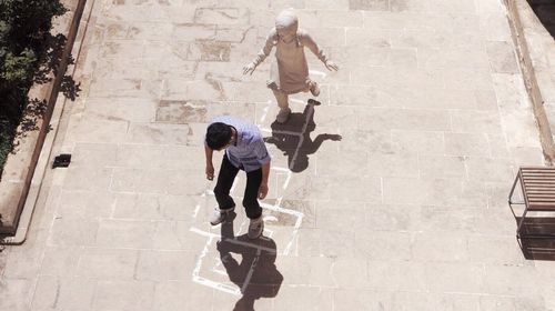 High angle view of people walking on street