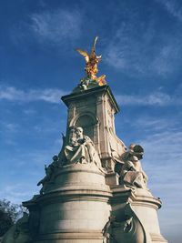 Low angle view of victoria memorial statue against sky