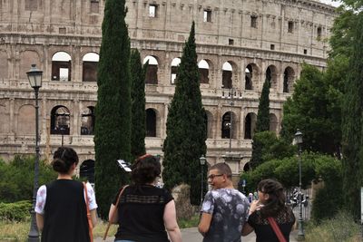 Group of people in front of historical building