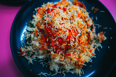 Close-up high angle view of fried rice in plate on table