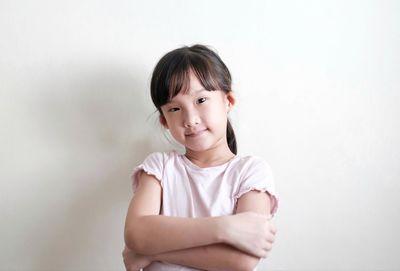 Portrait of a smiling girl over white background