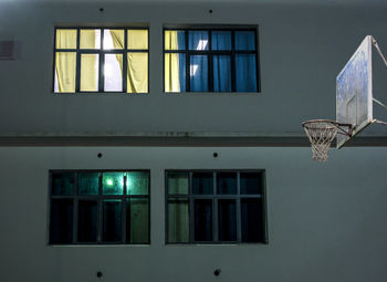 View of illuminated school windows from the schoolyard.