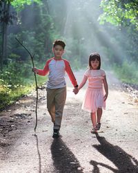 Full length of mother and daughter outdoors