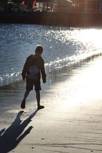 Full length of woman standing in water