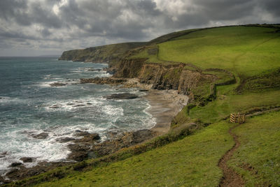 Scenic view of coastline against sky