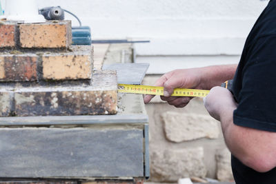 Man working with tape measure