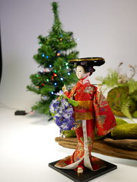 Close-up of figurine on christmas tree