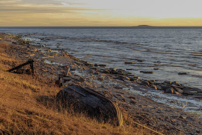 Scenic view of sea against sky at sunset