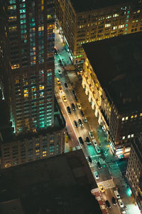 High angle view of illuminated buildings in city at night