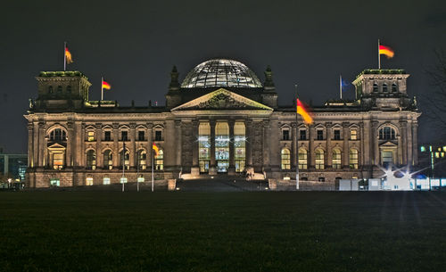 Facade of historical building at night