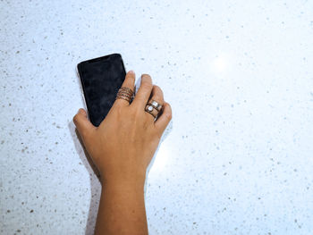 Close-up of woman hand on wall