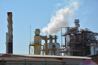 Smoke emitting from chimney at factory