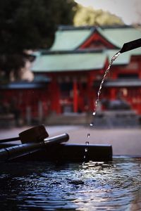 Close-up of red water against built structure