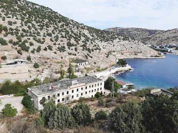 High angle view of buildings by sea