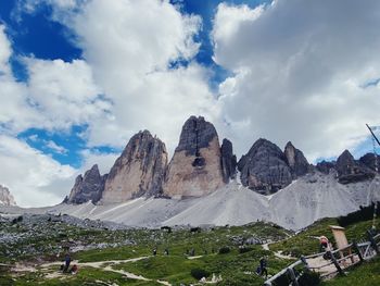 Scenic view of mountains against cloudy sky