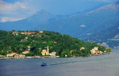High angle view of boat moving in lake como against mountains