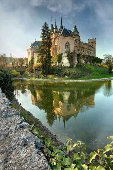 architecture, built structure, reflection, water, building exterior, place of worship, religion, tree, spirituality, sky, lake, church, pond, river, history, standing water, waterfront, travel destinations, day