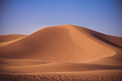 Scenic view of desert against clear sky