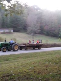 People on road amidst field