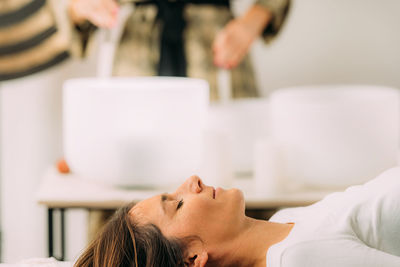 Crystal singing bowls in a sound healing therapy session