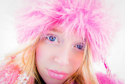 Portrait of beautiful woman wearing fur coat in winter