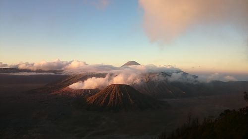 View of volcanic landscape against sky during sunset