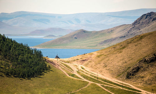 Scenic view of landscape and mountains against sky