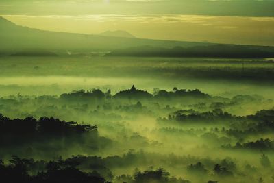 Scenic view of landscape against sky during sunset