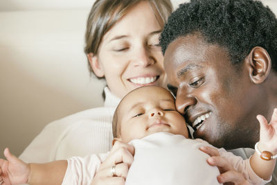 Close-up of parents with baby daughter