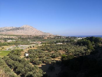 Scenic view of landscape against clear blue sky