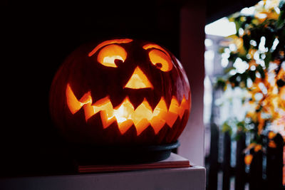 Illuminated candles on pumpkin