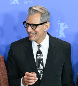 Man wearing mask against gray background