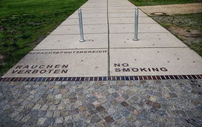 High angle view of text on footpath in park