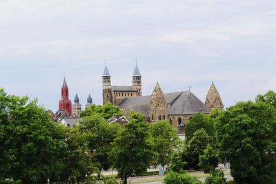 View of trees and buildings against sky