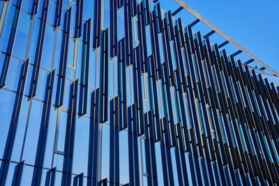 Modern glass building facade with geometric design