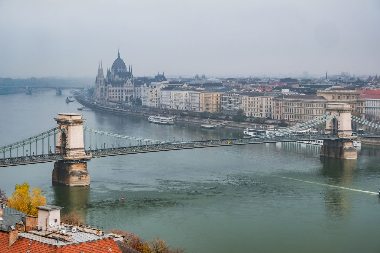 VIEW OF BRIDGE OVER RIVER IN CITY