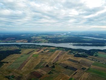 Aerial view of agricultural field against sky