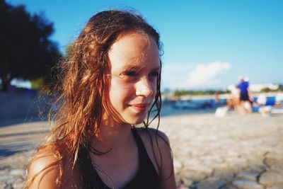 Close-up of smiling girl at beach