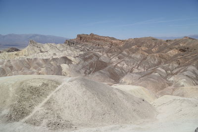 Scenic view of arid landscape against sky