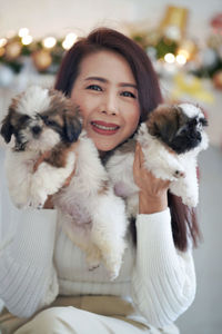 Portrait of young woman with dog