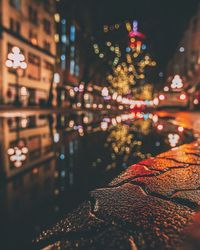 Defocused image of illuminated christmas lights at night