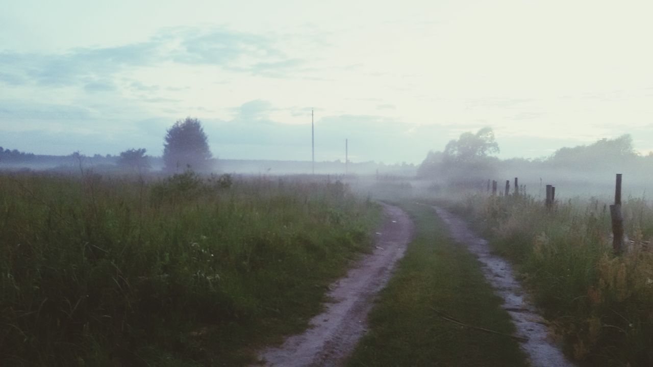 the way forward, sky, landscape, grass, field, diminishing perspective, tranquil scene, tranquility, dirt road, vanishing point, nature, road, rural scene, country road, plant, scenics, cloud - sky, transportation, beauty in nature, outdoors