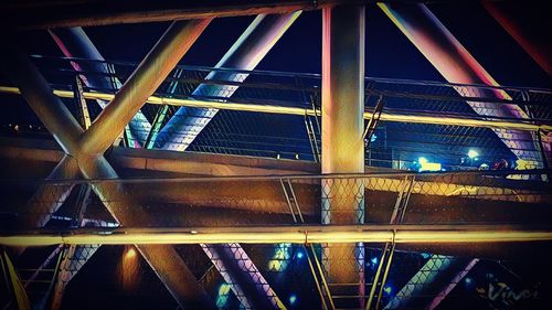 Low angle view of bridge against sky at night